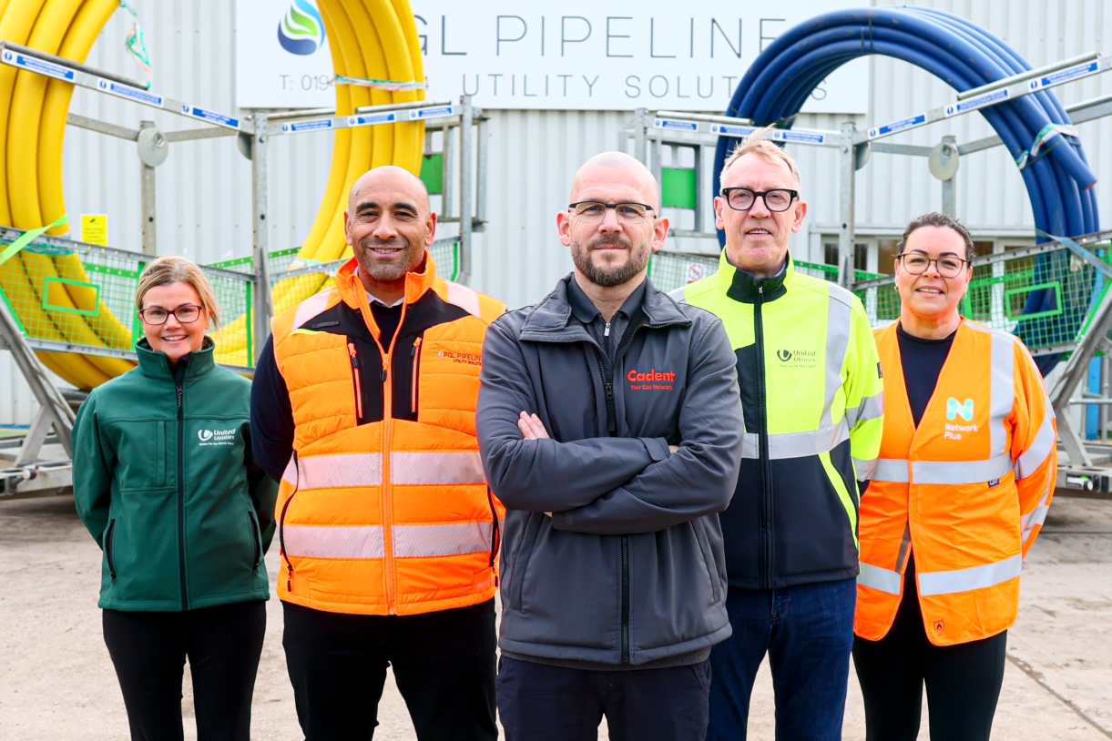 left to right, standing in front of yellow (gas) and blue (water) pipes - Jo Power, Programme Manager, United Utilities; Aaron Ashbarry, Managing Director, PGL Pipelines; Gareth Lloyd, Streetworks Manager, Cadent; Michael McEllin, Senior Project Manager, United Utilities; Charlotte Robinson, Site Manager, Network Plus.