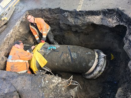 Engineers with pipe at Oval