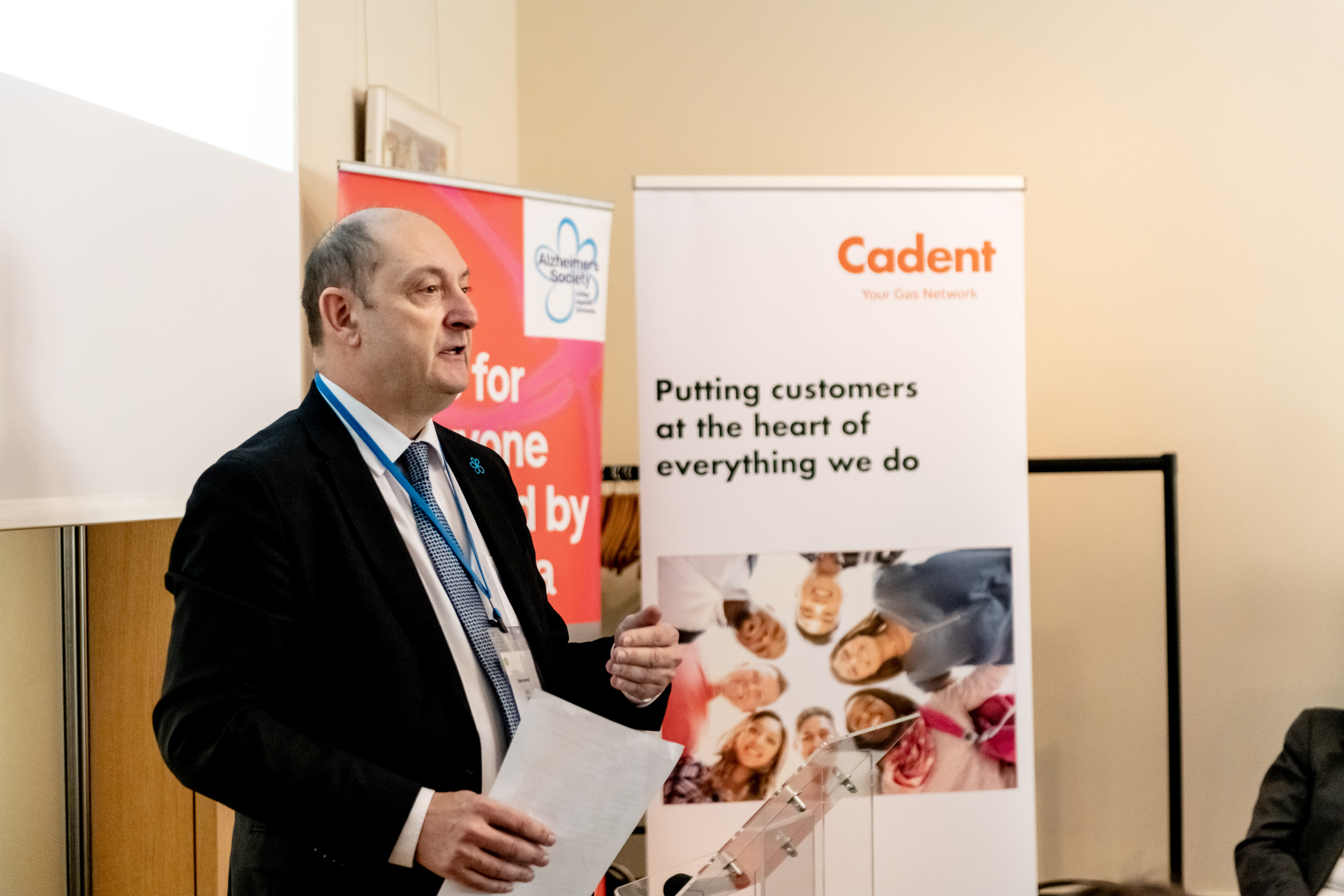 Cadent banner in background and a person giving speech