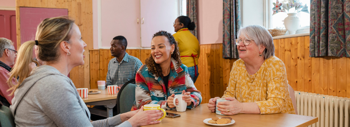 A shot of a small group of people visiting a warm hub/food bank which is a safe place for people to enjoy a warm and friendly environment in the community with the current cost of living increasing.