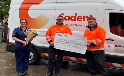 A man receiving customerincentive cheque