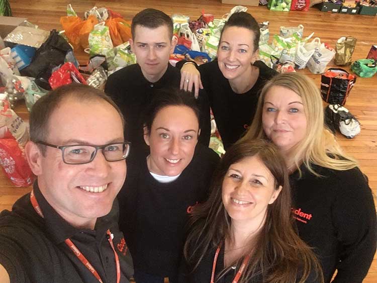 Cadent team with gift packings for Christmas